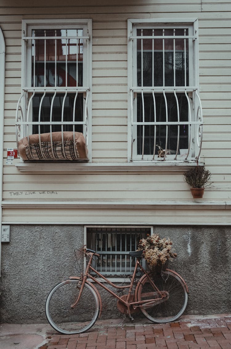 Facade Of 20th Century Building With Three Barred Widows 