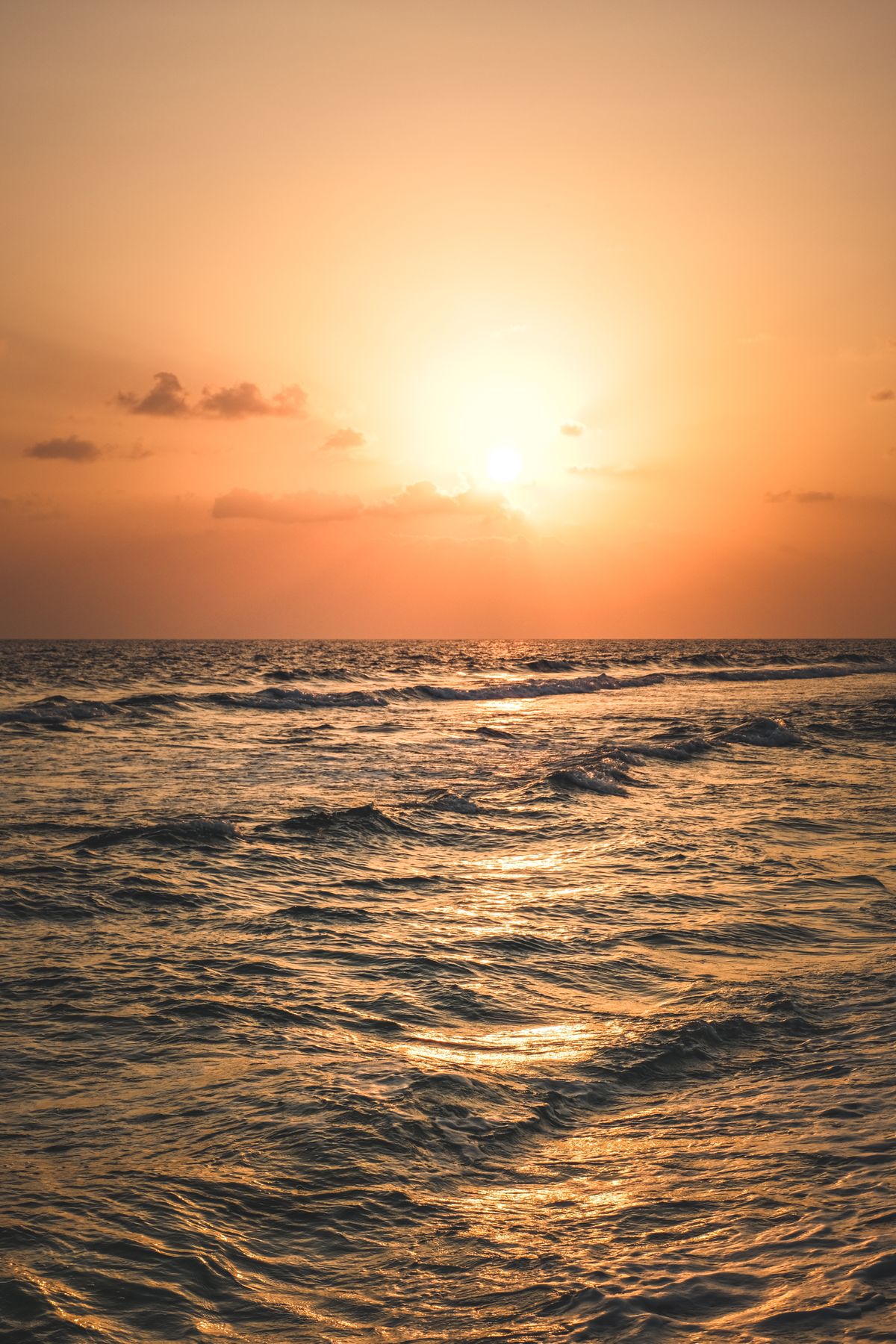 Golden sunrise over the ocean horizon, symbolizing unlocking full potential
