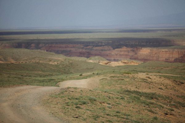 A dirt track across open steppe — Alexey Demidov on Pexels
