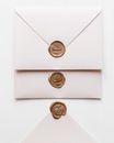 Three White Envelopes Two Sealed with Wax Seal