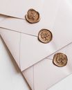 White Envelopes Arranged by Wax Seals in Row