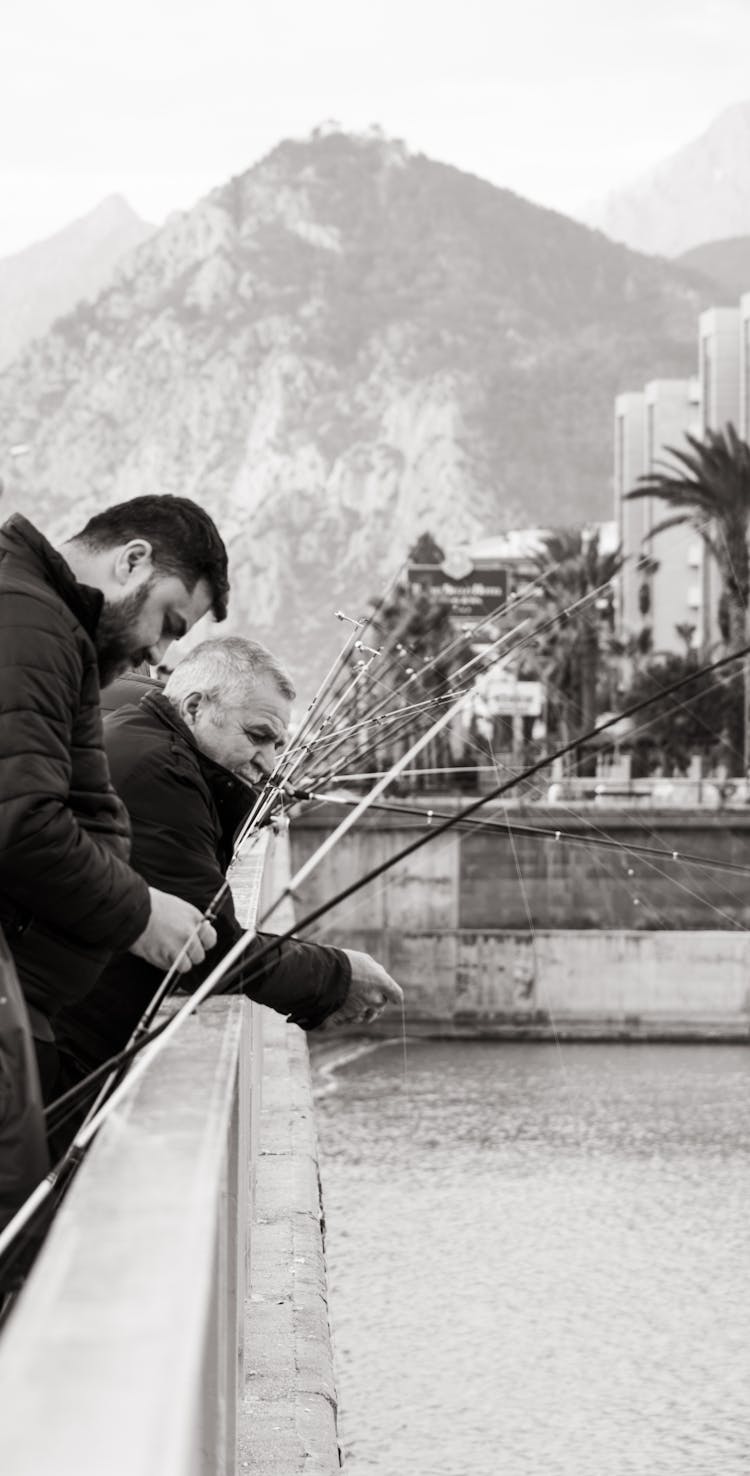 Men Fishing From The Bridge