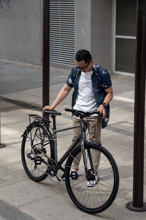 A Man Parking His Bicycle