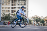 Man Riding a Bike on the Street