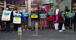 Group of People Standing on Sidewalk