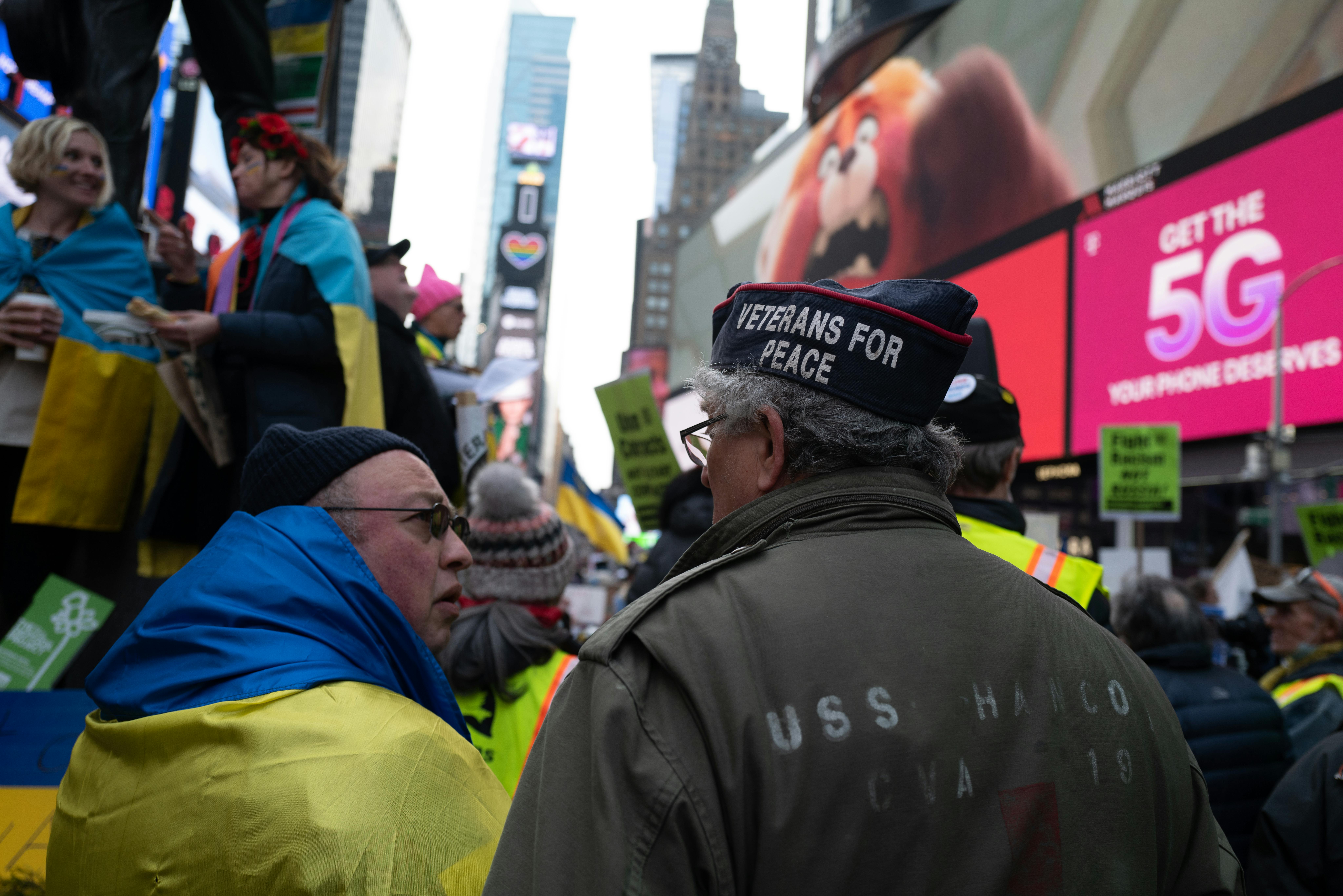 Protesters in Times Square, New York, advocating peace and supporting Ukraine.