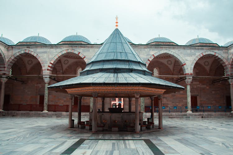 Gazebo Near A Building With Arches And Dome Roof