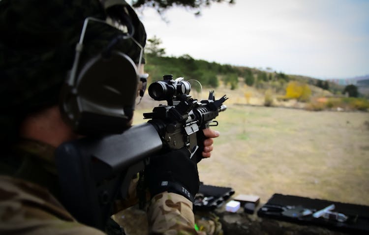 A Person Using A Rifle In Target Shooting