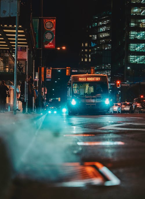 A Moving Bus on the Road at Night