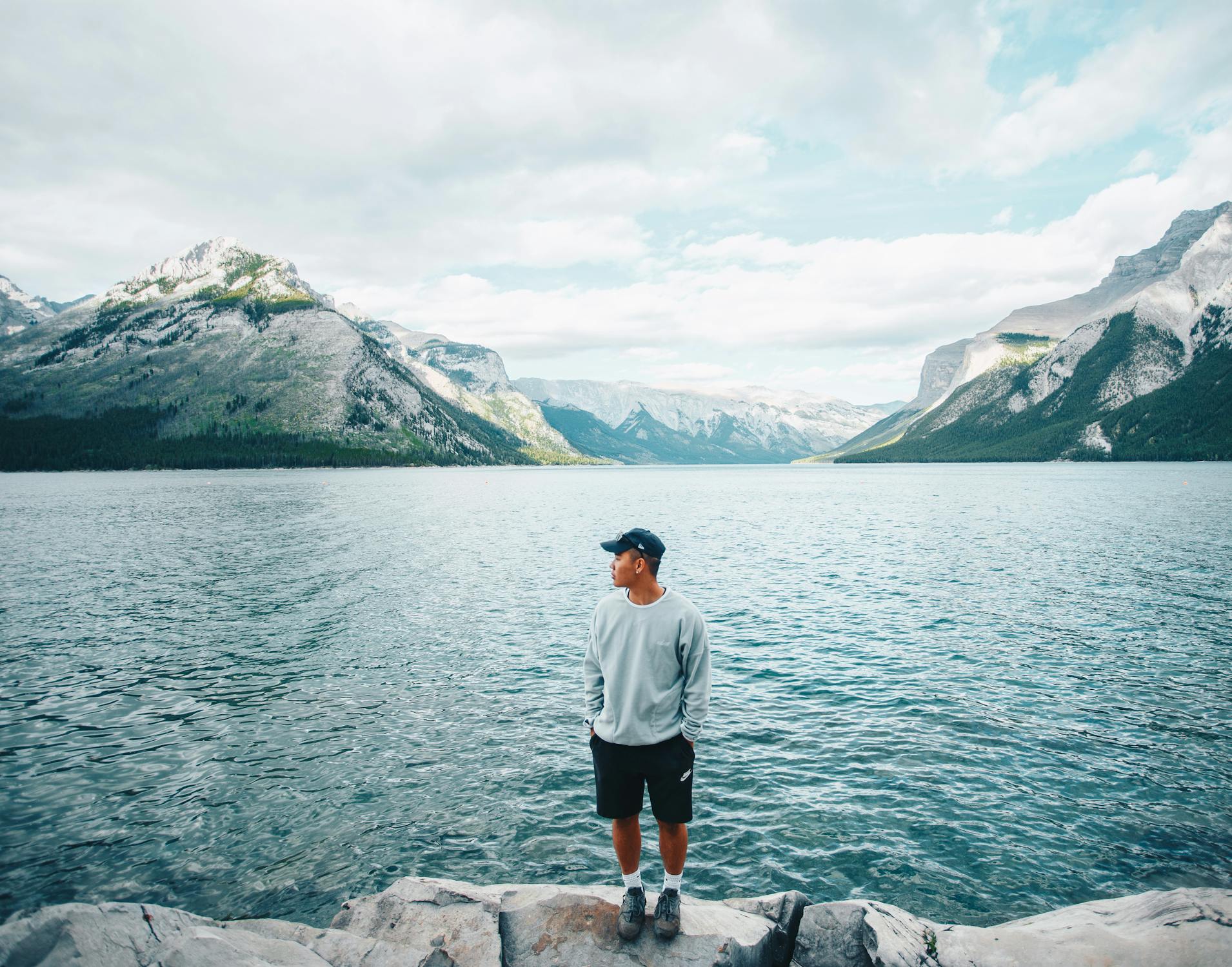 A person standing in front of a Canadian tourist destination 