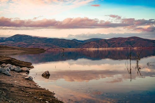 A Lake Near the Mountain Under the Cloudy Sky