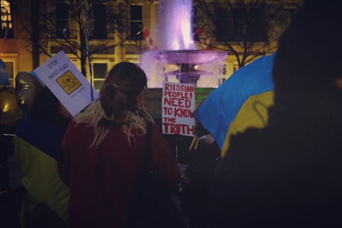 People Doing Rally on the Street at Night