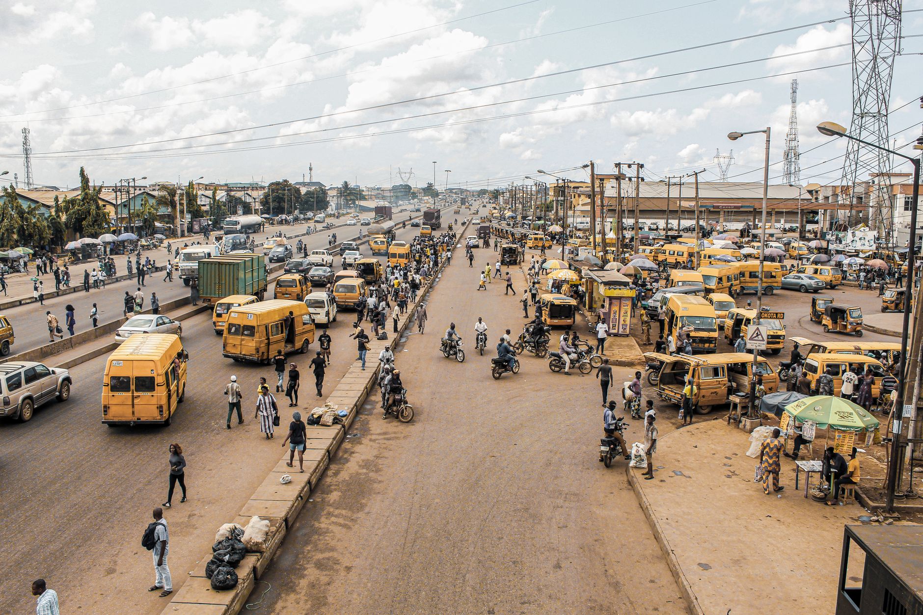 Busy Lagos roads with traffic and yellow buses