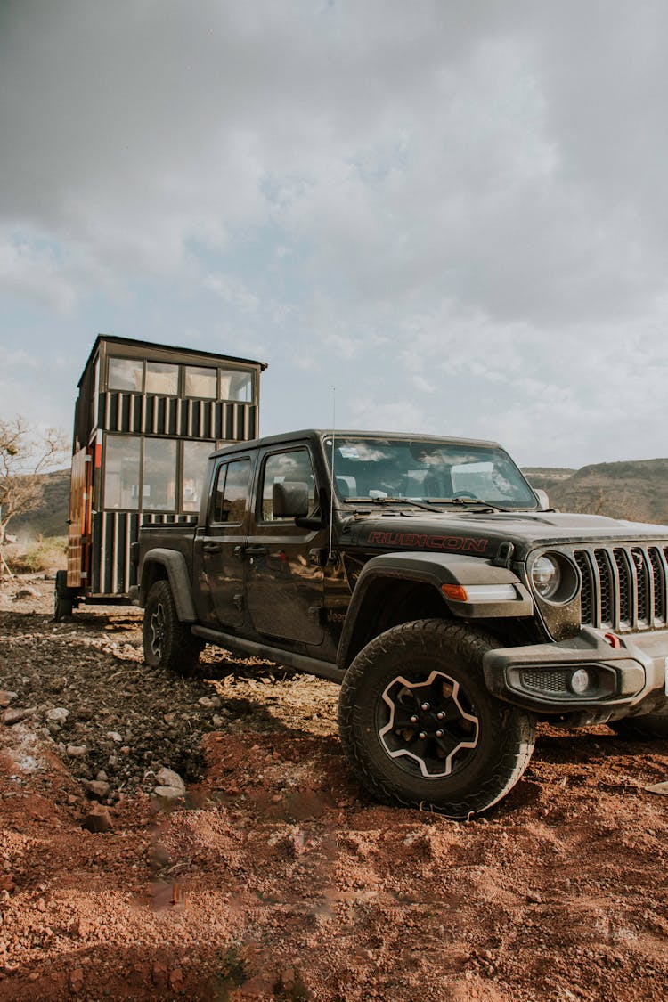 Black Jeep Wrangler On Dirt Road 