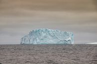 Brown Rock Formation on Sea Under Gray Sky