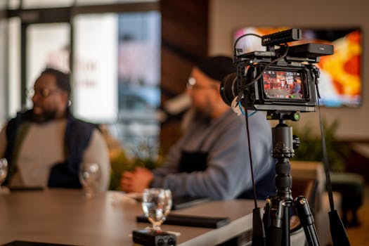 Professional video setup capturing a casual meeting at a café in Camden, NJ. Ideal for media projects.