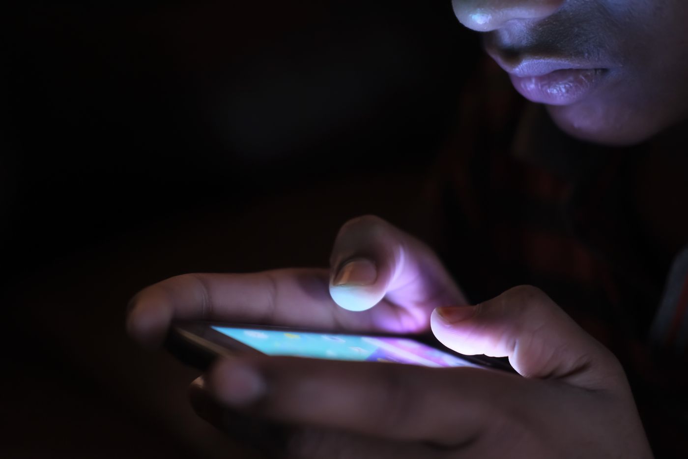 A phone glowing in the dark