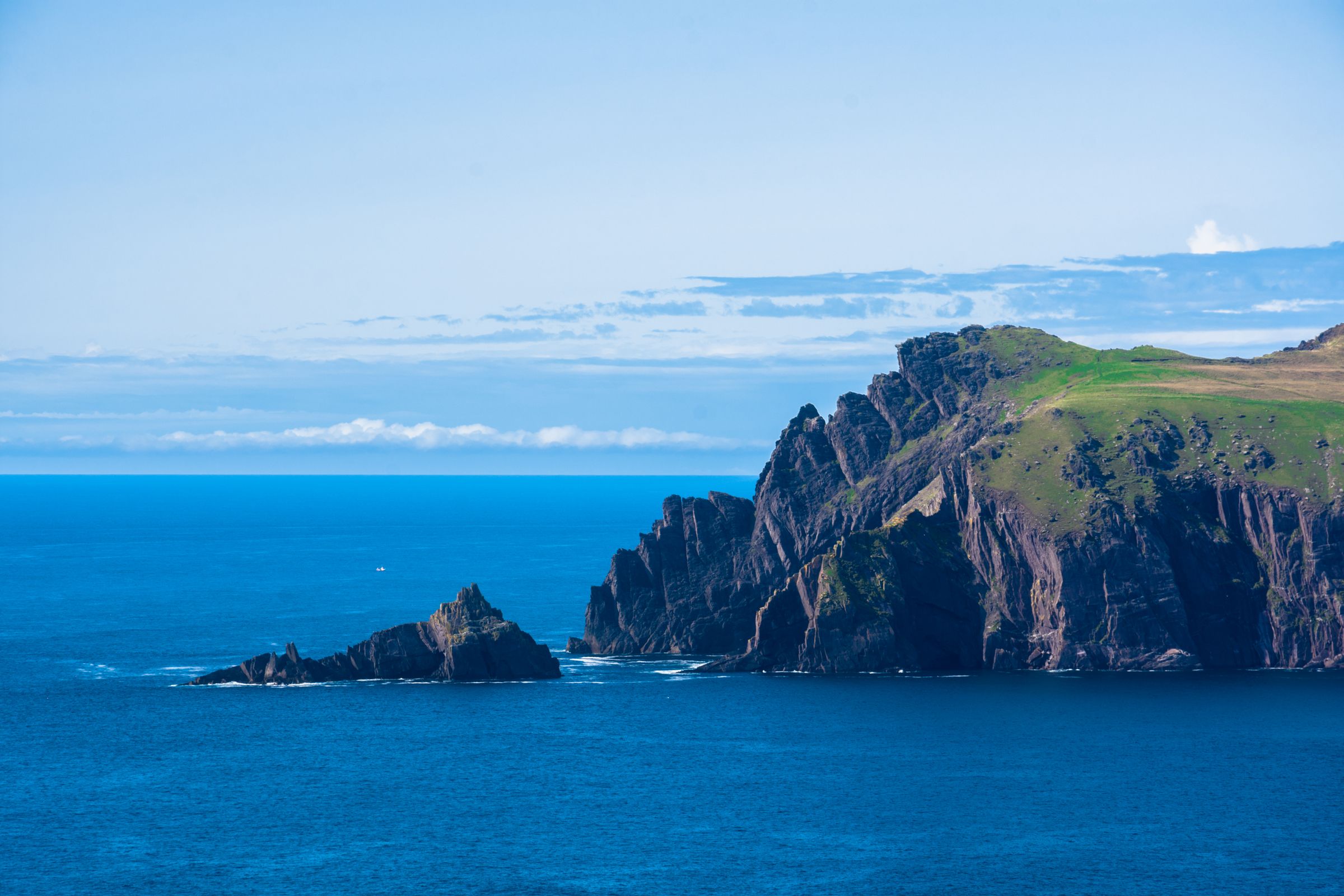 Rugged beauty of Ireland's coastline with these cliff formations against a blue sea