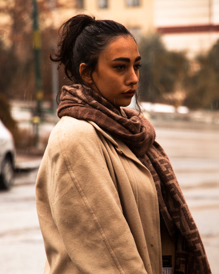 Woman Wearing Coat And A Scarf