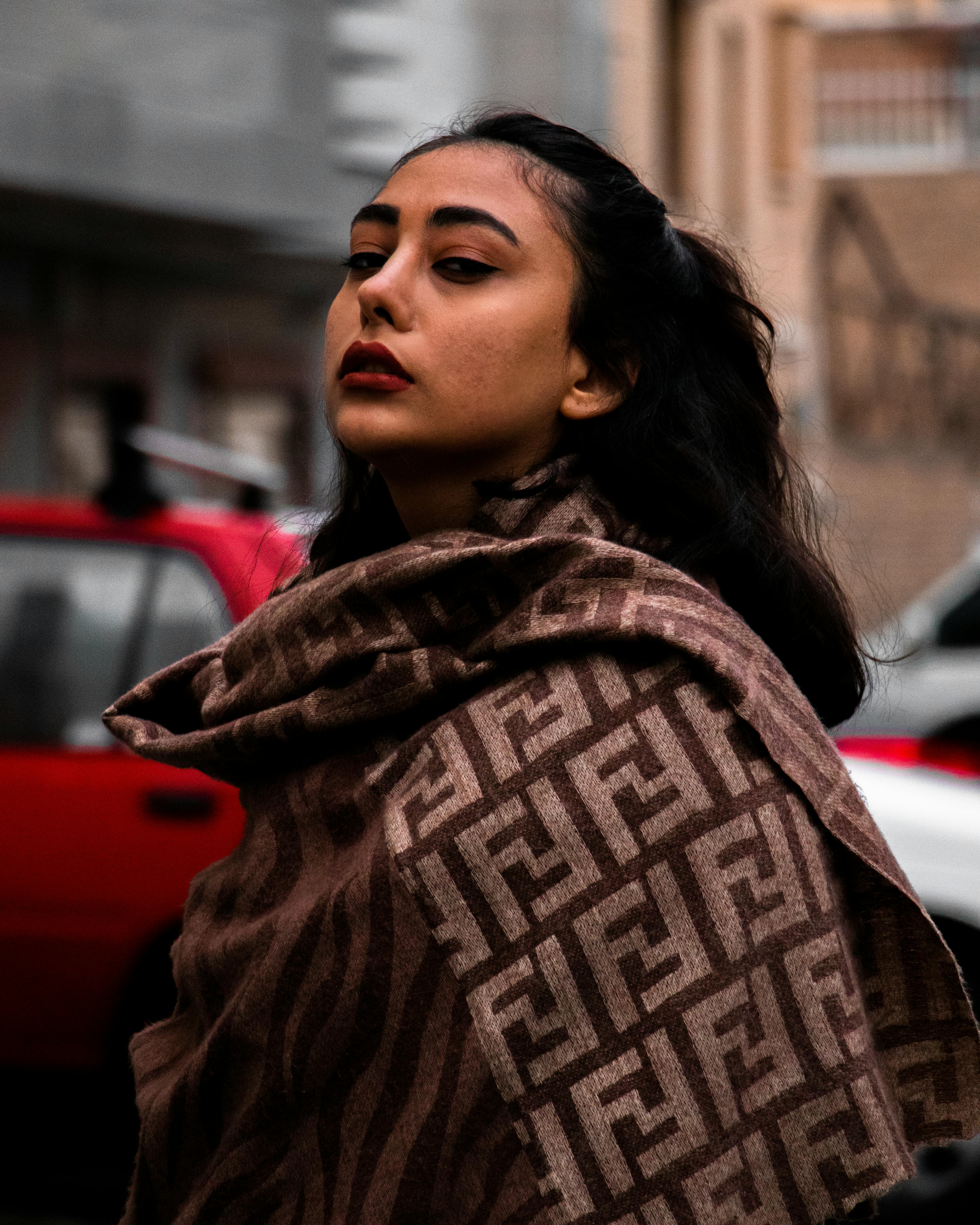 a woman in brown coat