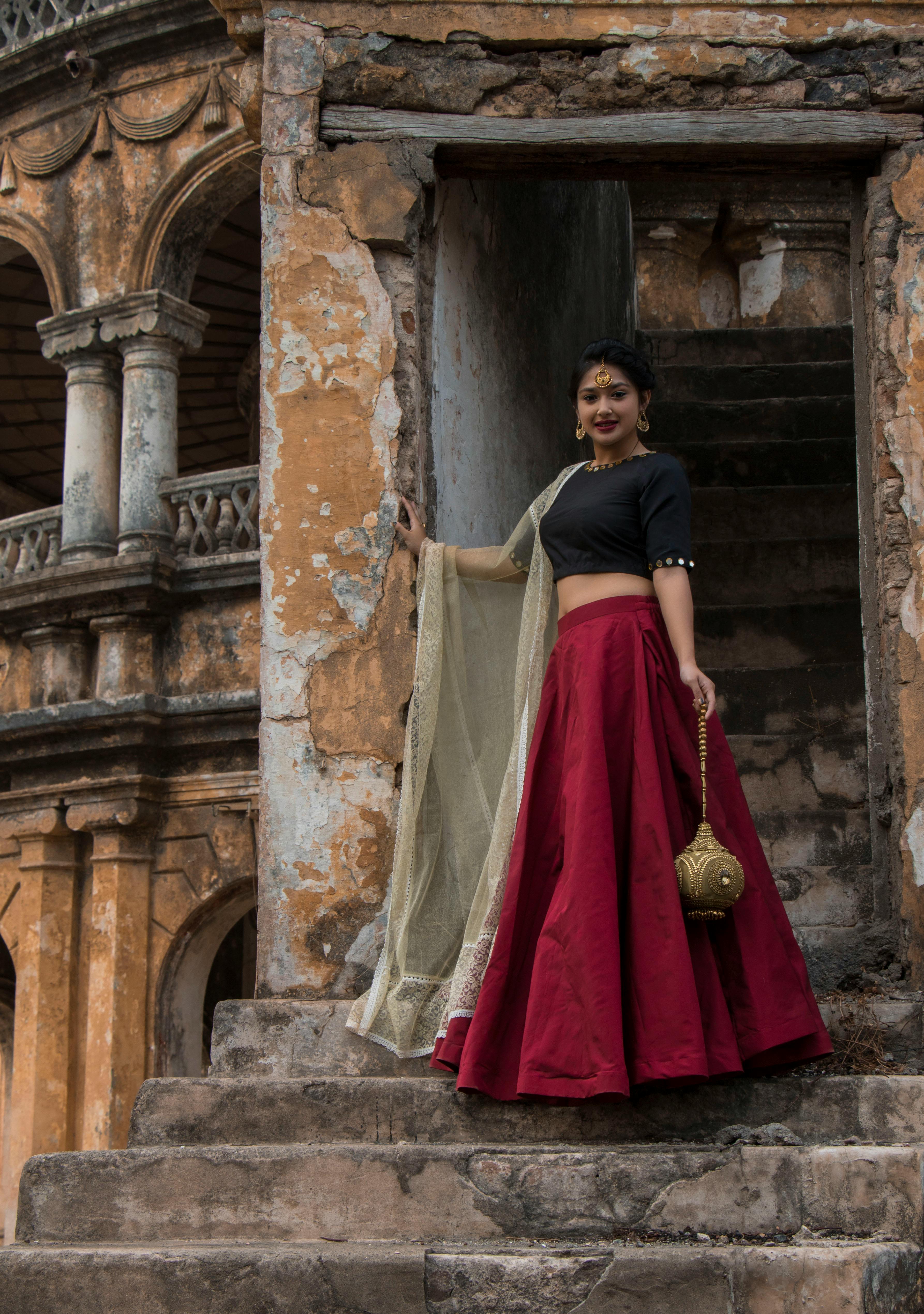 Malaika Arora in Timeless look in a red lehenga, black blouse with silver  embroidery work | Moviekoop