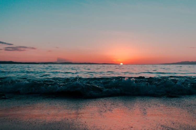 Scenic Of Ocean During Sunset