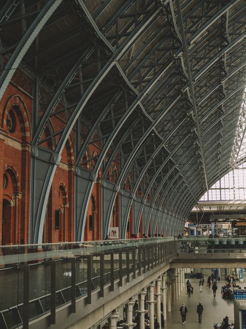 Captivating view of iron and brick architecture in a historic train station interior.