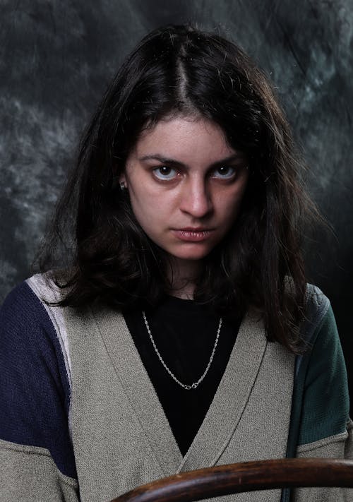 Woman in Cardigan with a Fierce Look