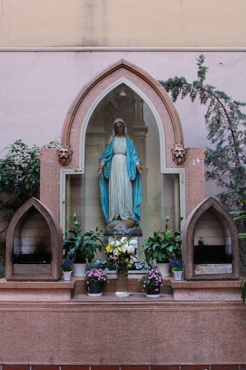 A Statue of Virgin Mary in a Shrine