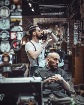 Photographer captures candid moment in trendy barbershop.