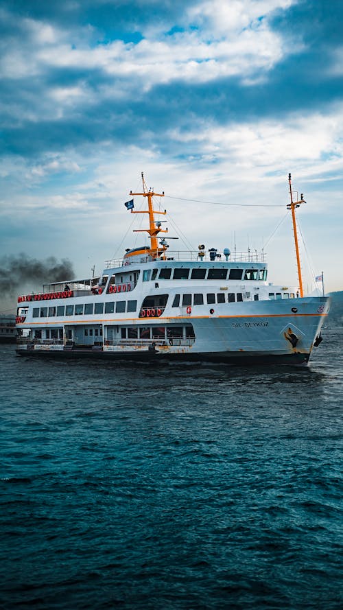 A White Ferry Boat Sailing on the Sea