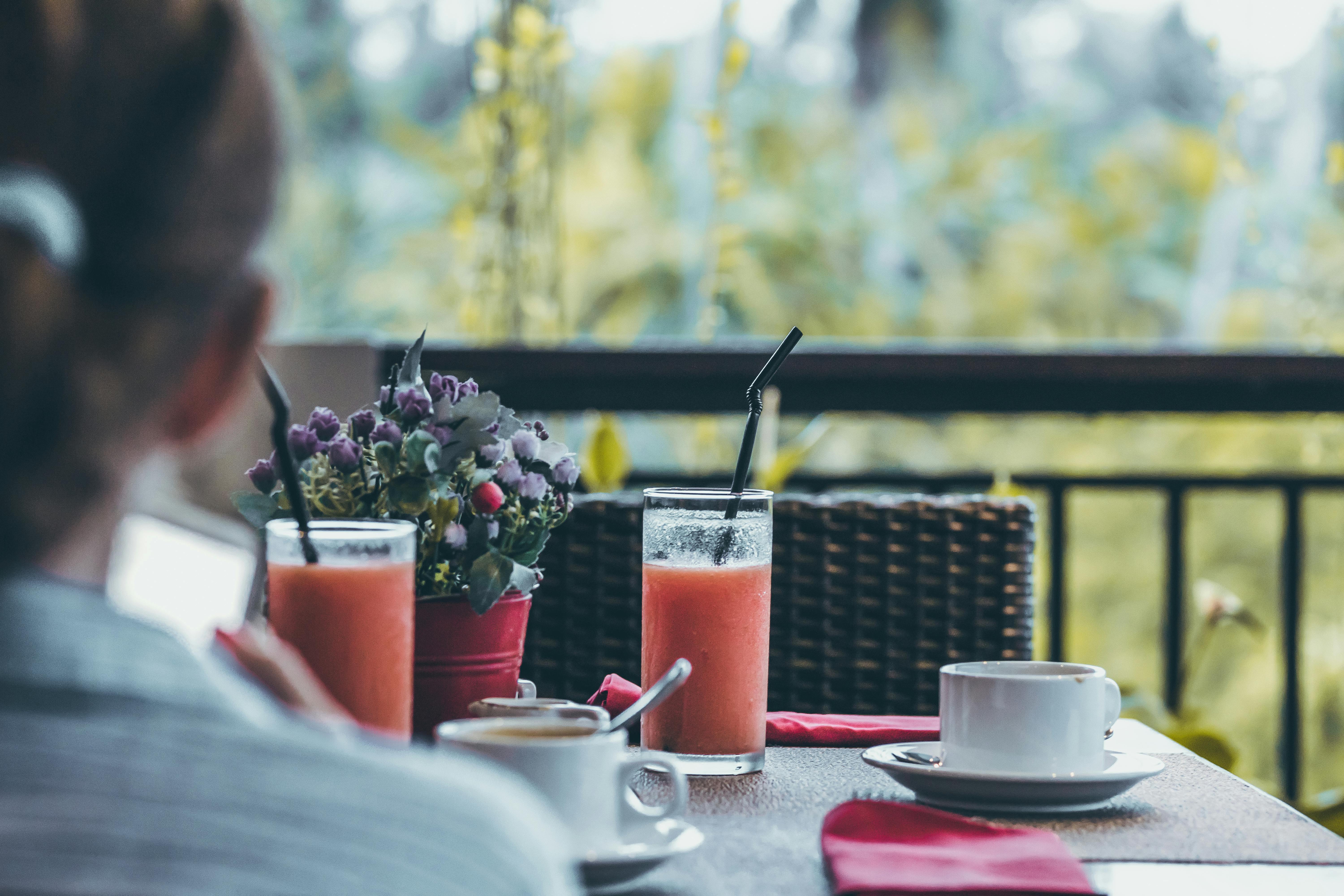 Filled Drinking Glass on Table