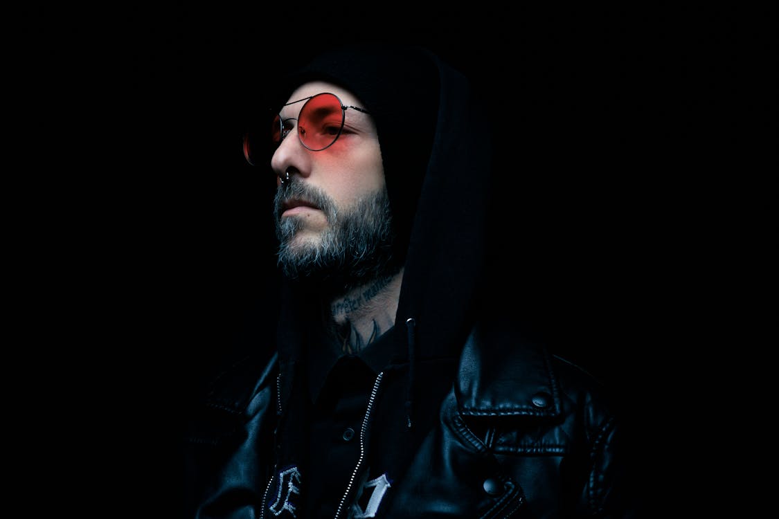 Man in a Black Leather Jacket Wearing Sunglasses