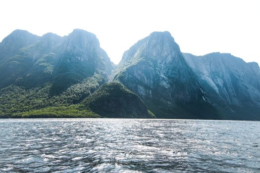 Stunning view of towering mountains and shimmering sea in Gros Morne, Newfoundland, Canada.
