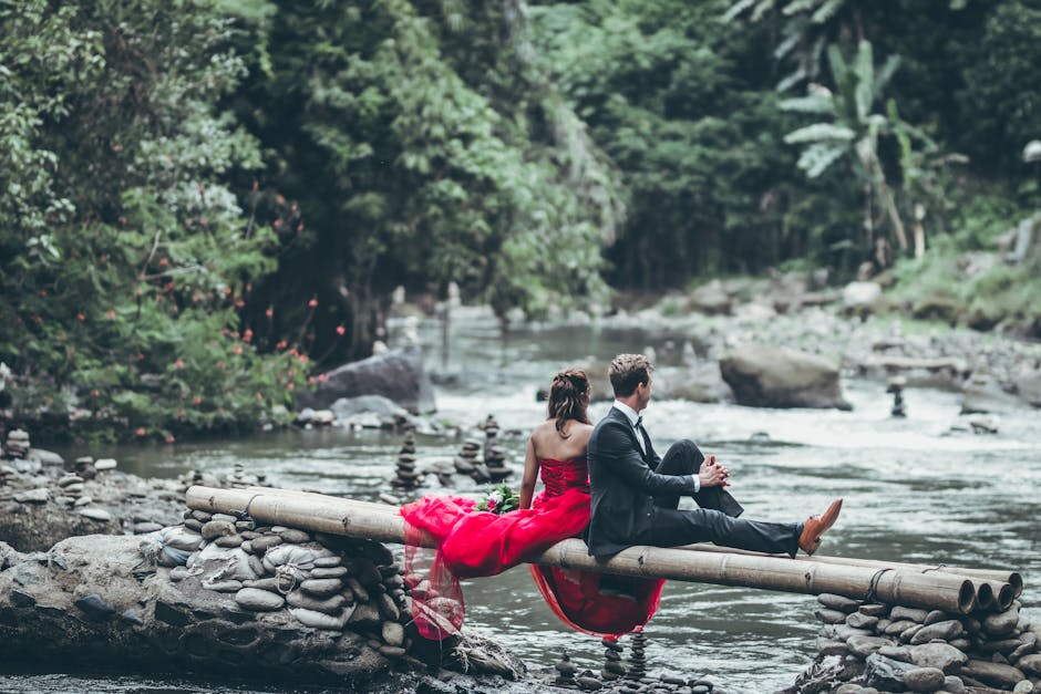 Man And Woman Sitting On Bamboos