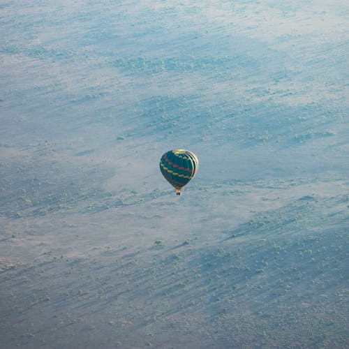 Hot Air Balloon Flying Over National Park