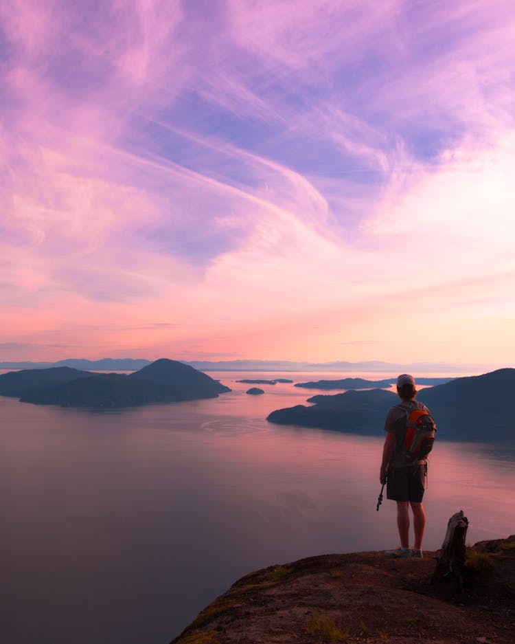 Man Standing On Mountain Top