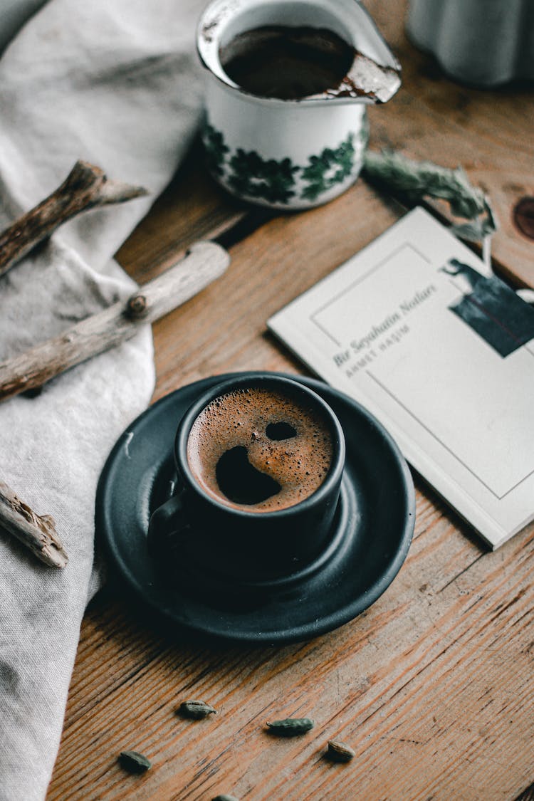 Cup Of Coffee On Messy Table