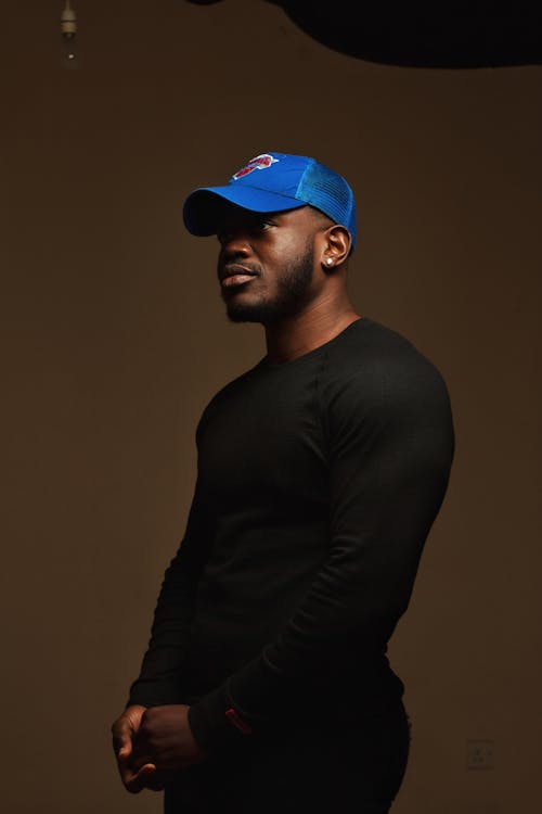 Free A Man in Black Long Sleeves and Blue Cap Stock Photo