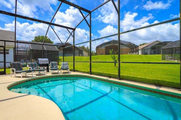 Pool Chairs Beside A Swimming Pool