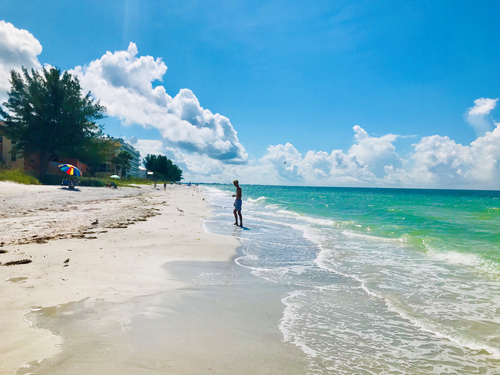 Free stock photo of aqua blue water beach, florida beach, person on beach Stock Photo