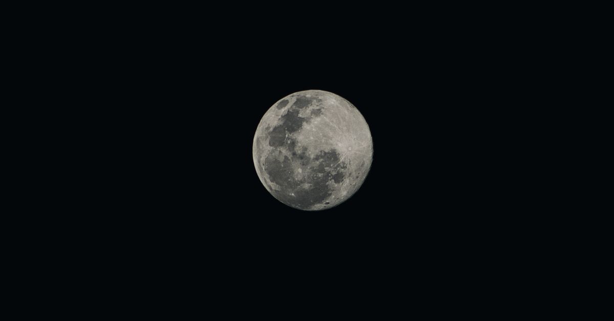 A detailed view of the full moon captured during a clear night sky, showcasing lunar features.