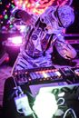 Man in Black and White Costume Playing Audio Mixer
