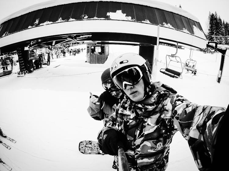 Man Taking Selfie On Snowboard