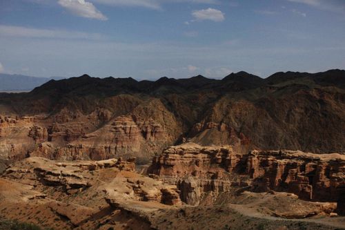Free Explore the stunning rocky formations of a vast canyon under a bright blue sky, showcasing nature's grandeur. Stock Photo