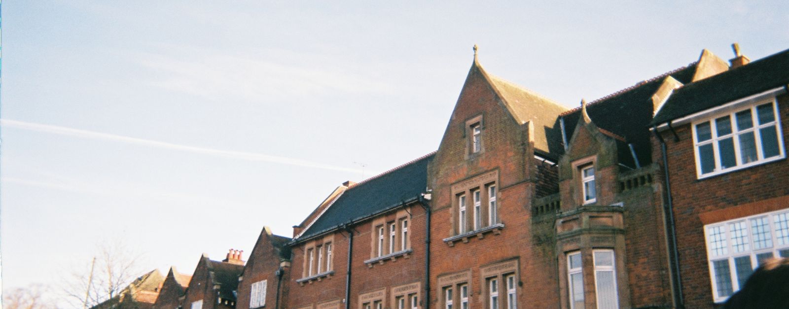 Charming brick architecture under clear skies in St Albans, UK.