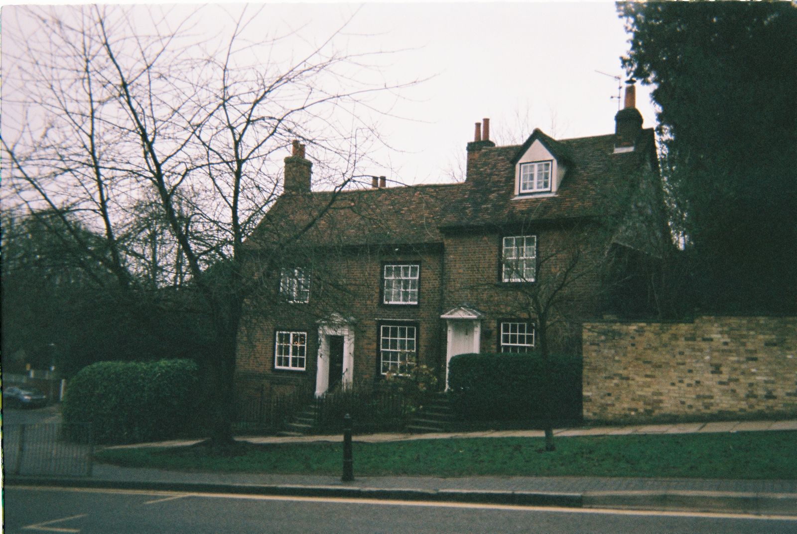 Traditional UK semi with painted timber weatherboard
