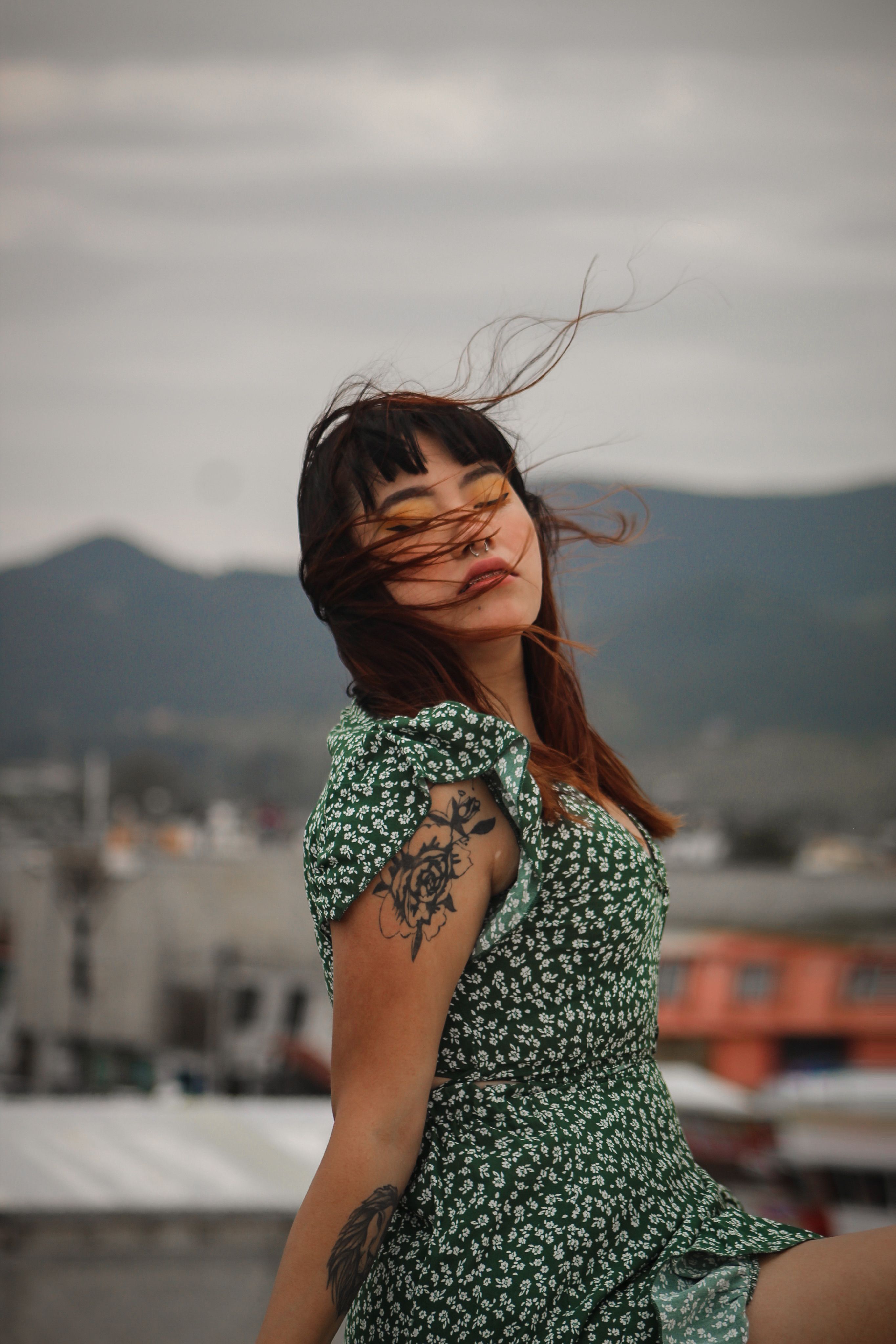 A Woman in Floral Dress Sitting · Free Stock Photo