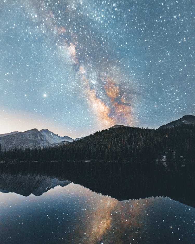 Galaxy Visible Above Mountains By Lake