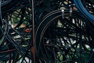 Black Coated Wire on Green Grass